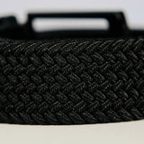 Black braided belt on a light background