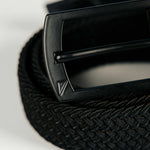 Black belt with a buckle on a light gray background