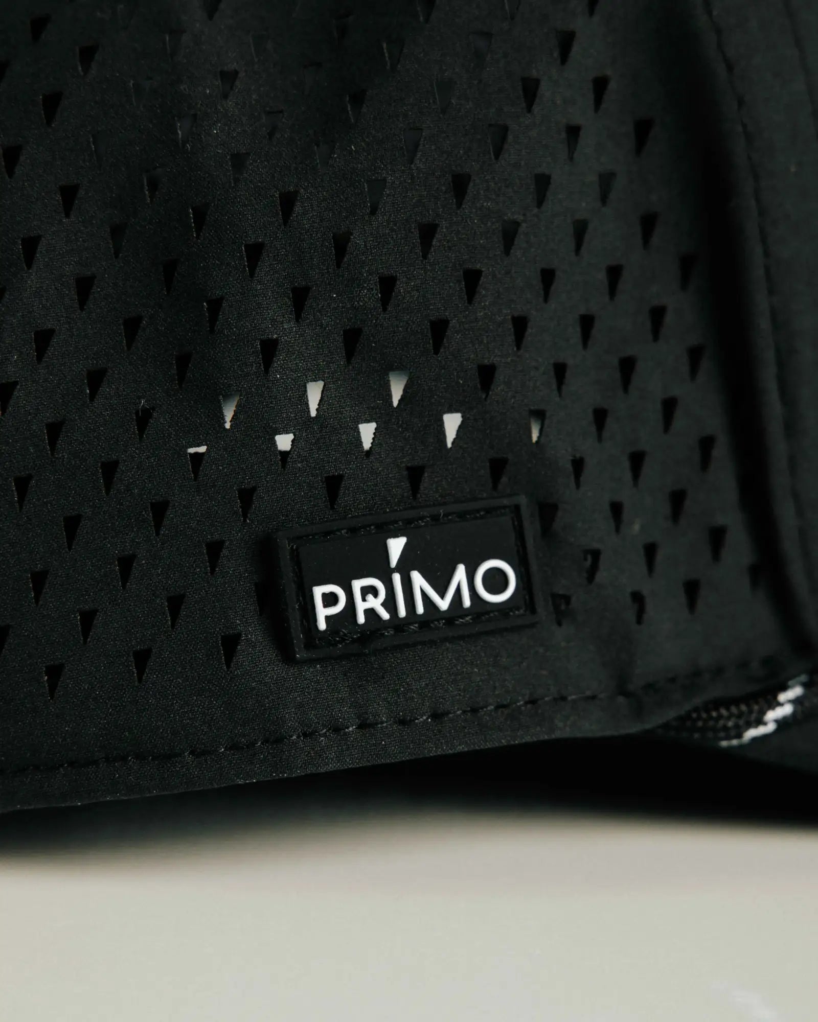 Primo logo sewn to side of cap