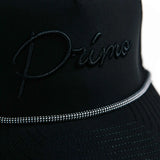 Black cap with 'Primo' embroidery on a white background