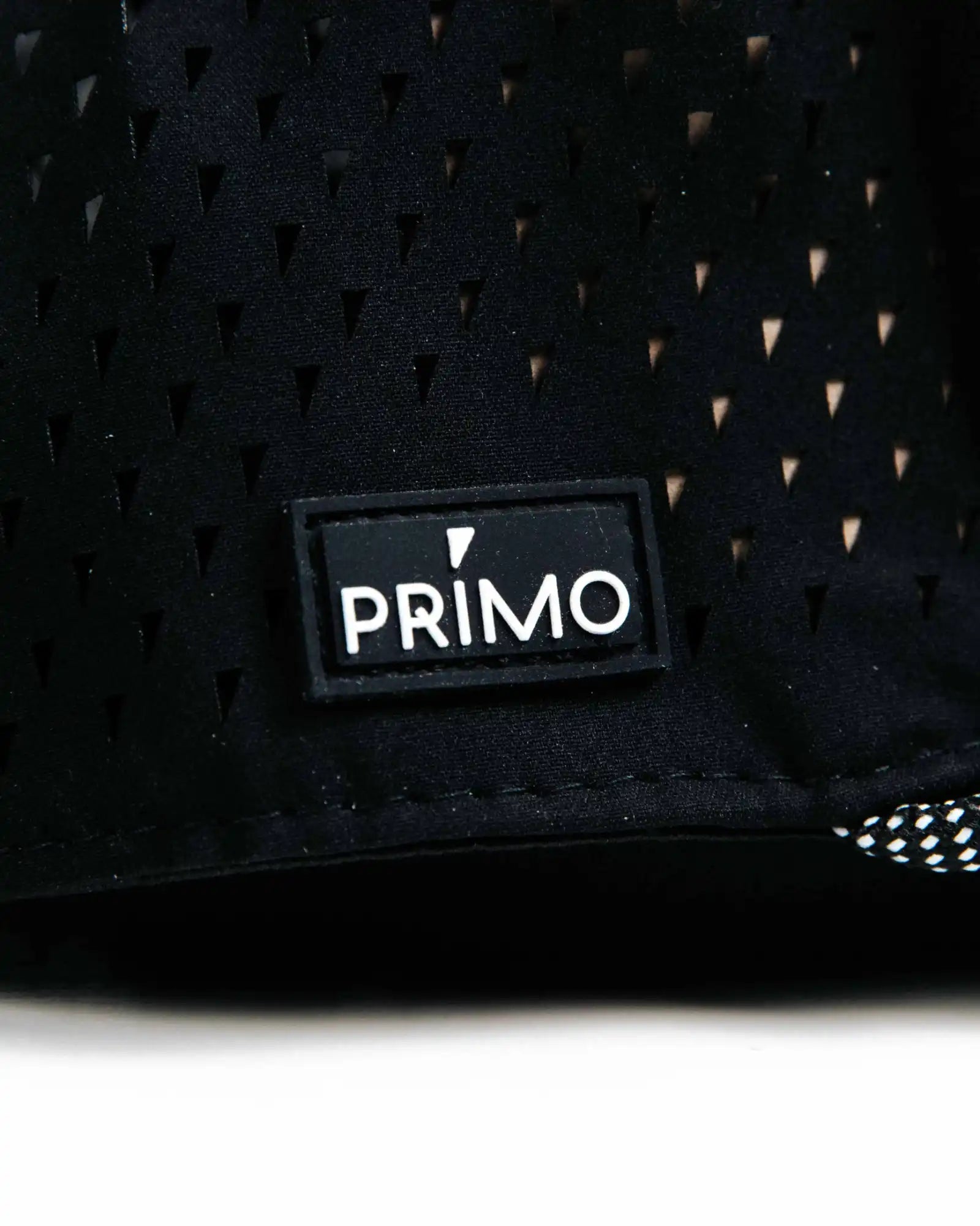 Black textured product with a Primo logo patch on a white background