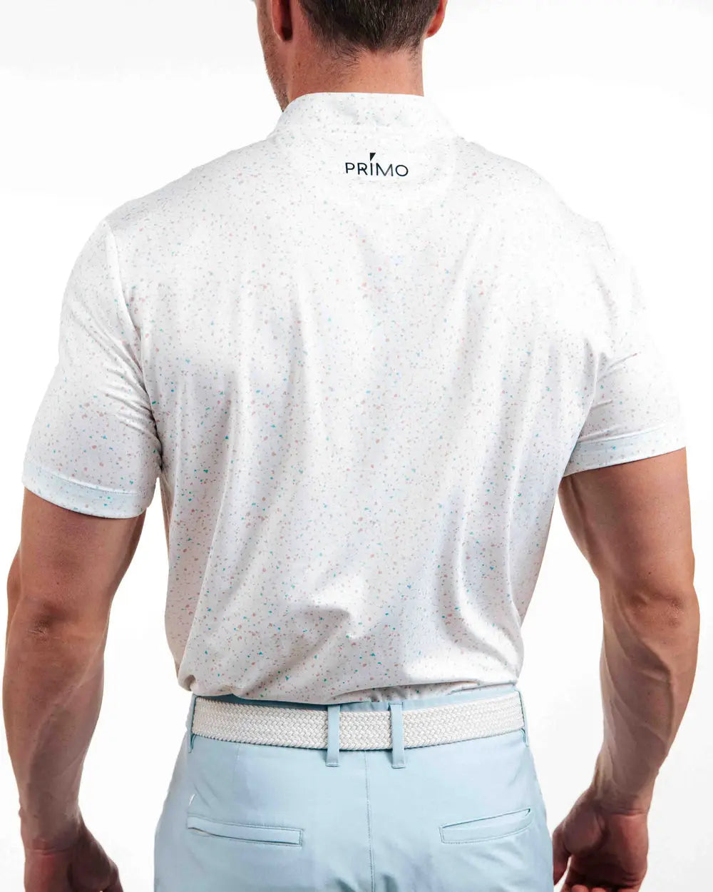 Man wearing a white polo shirt with 'Primo' branding on the back, standing against a white background.
