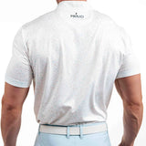 Man wearing a white polo shirt with 'Primo' branding on the back, standing against a white background.