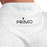 Close-up of a white shirt with colourful speckles and 'PRIMO' logo.