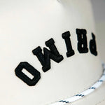 Side view of Primo embroidered logo on front of golf hat