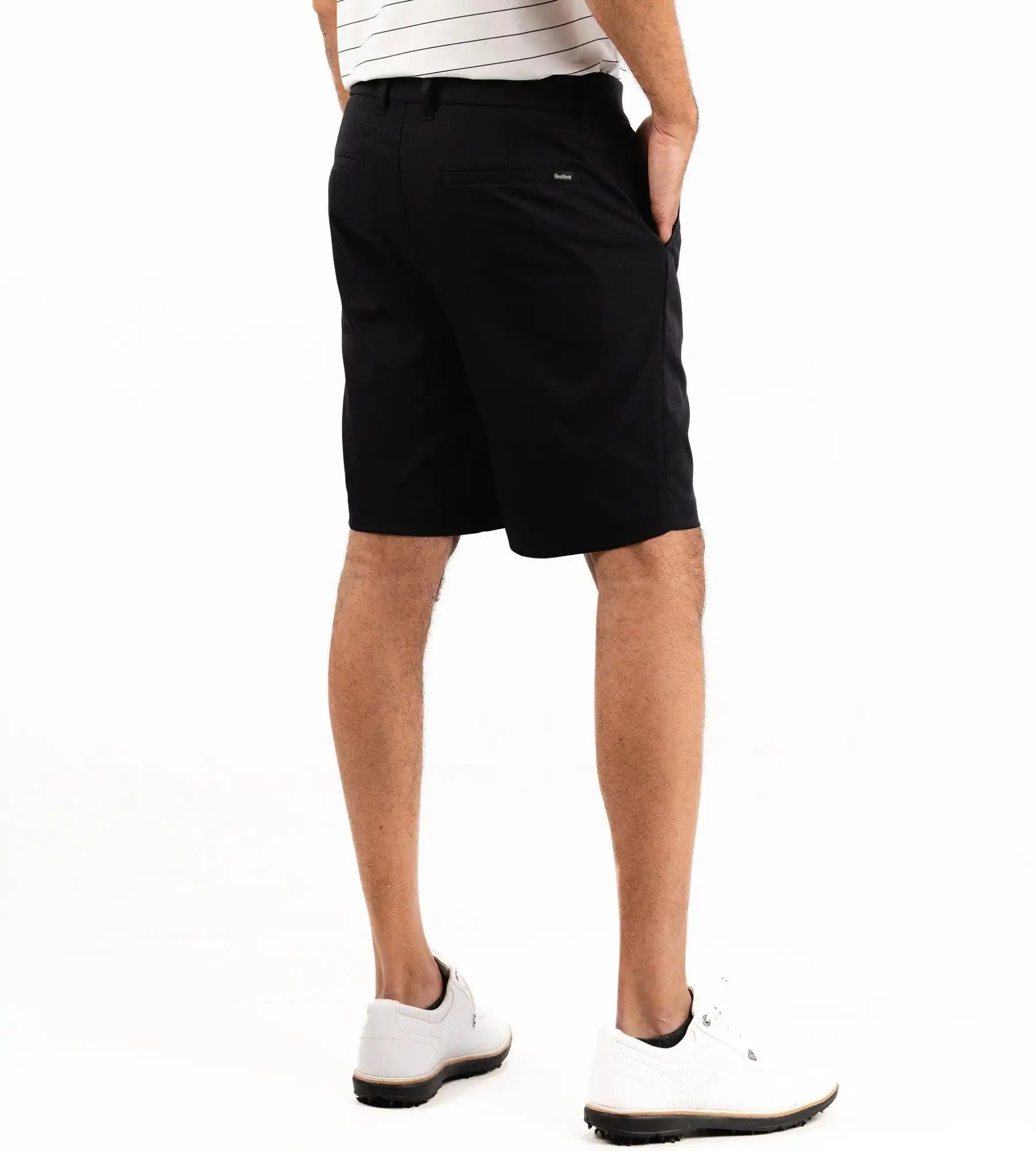 Person wearing black shorts on a white background