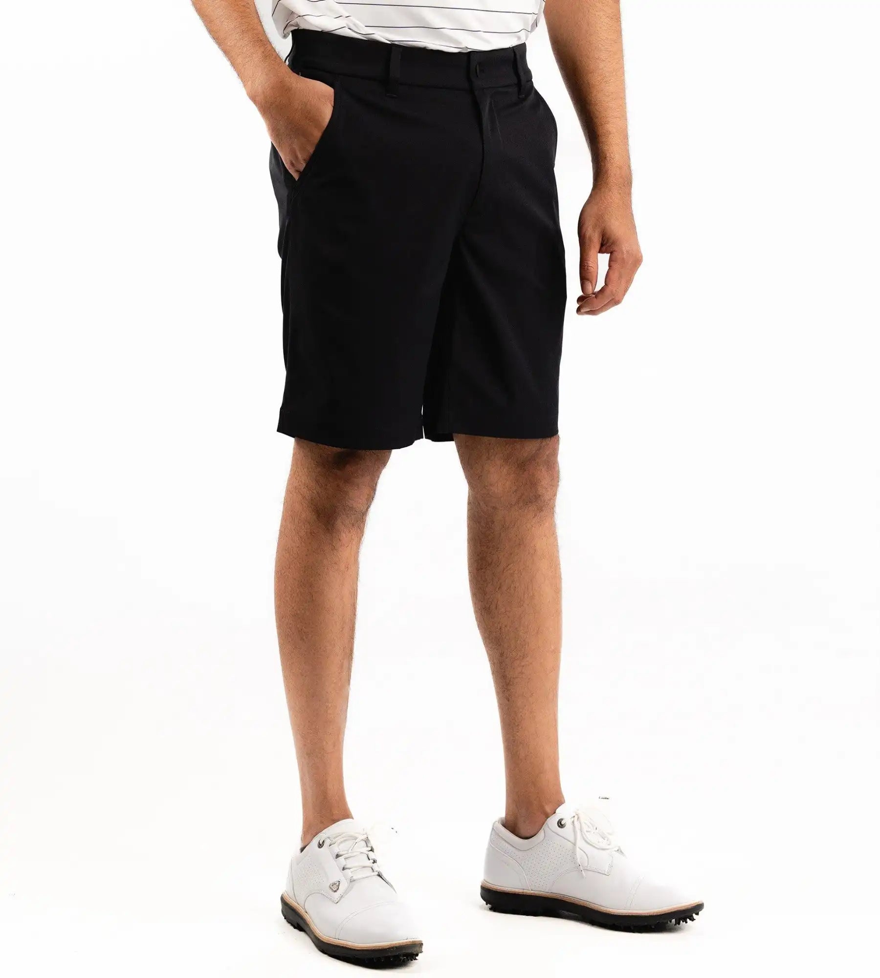 Person wearing black shorts on a white background