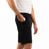 Person wearing black shorts and a white striped shirt on a white background