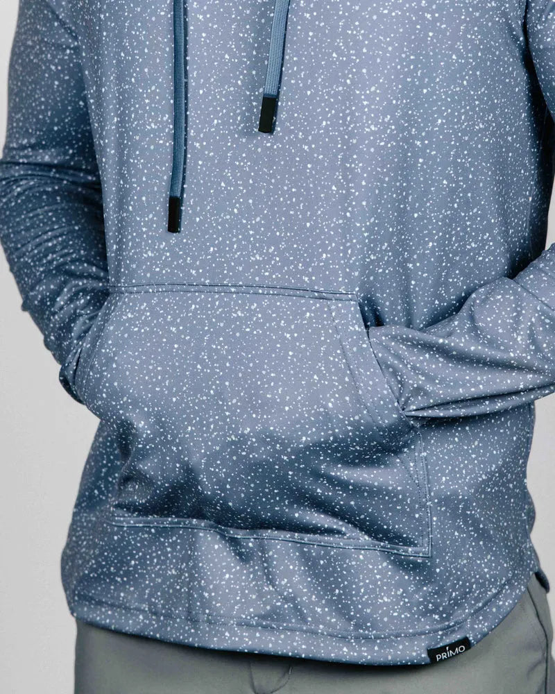 Blue patterned hoodie with a visible brand logo on a gray background