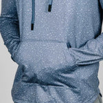 Blue patterned hoodie with a visible brand logo on a gray background
