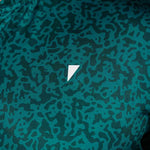 Green patterned fabric with a white triangle logo