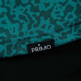 Teal camouflage fabric with a Primo logo tag