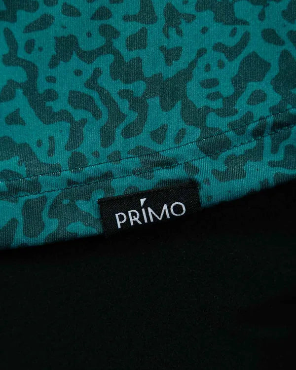 Teal camouflage fabric with a Primo logo tag