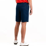 Person wearing navy shorts on a white background