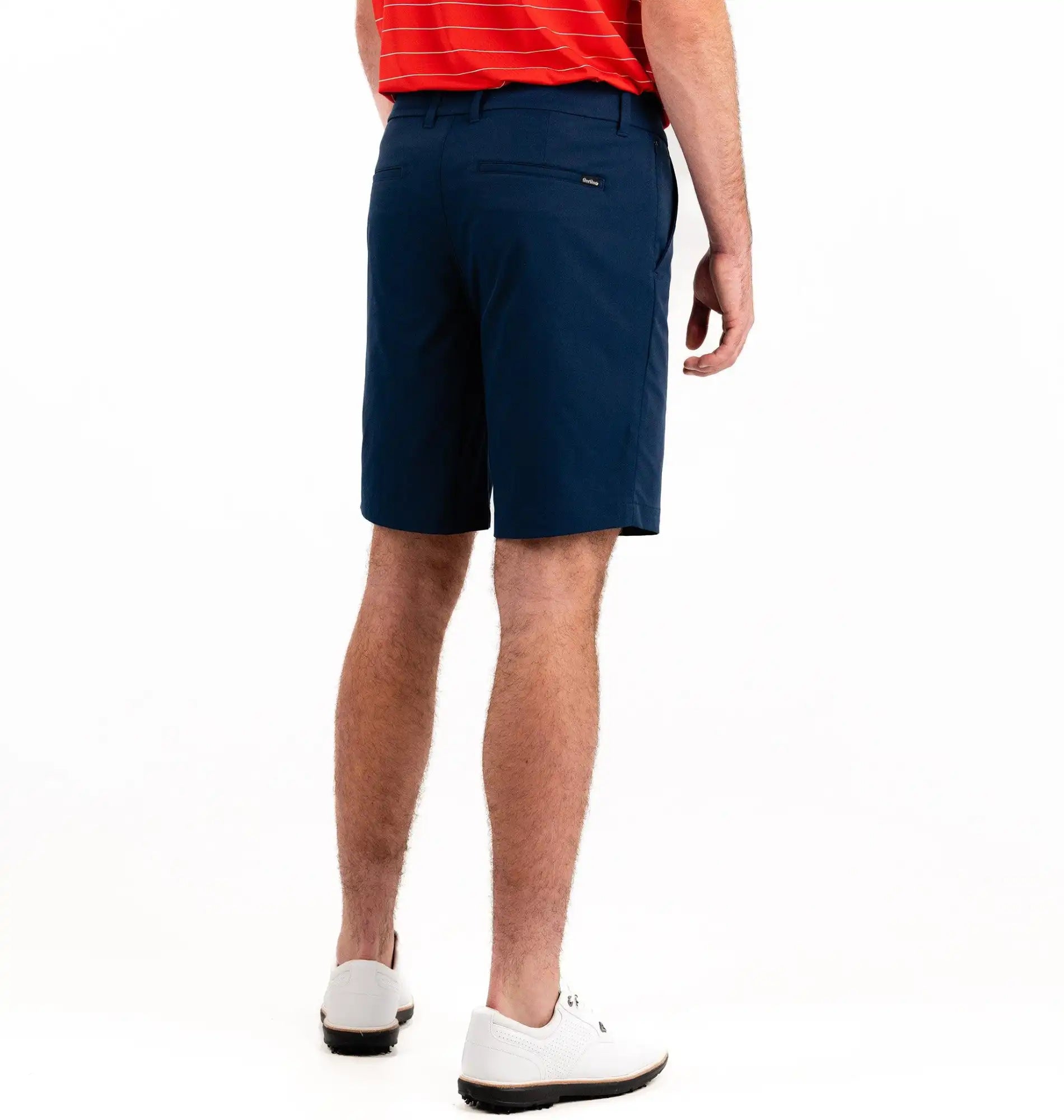 Person wearing navy shorts on a white background