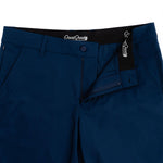 Close-up of blue pants with GoodGood label on waistband and pocket.