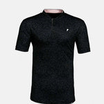 Black short-sleeve polo with a small white logo on a light gray background