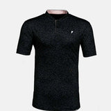 Black short-sleeve polo with a small white logo on a light gray background