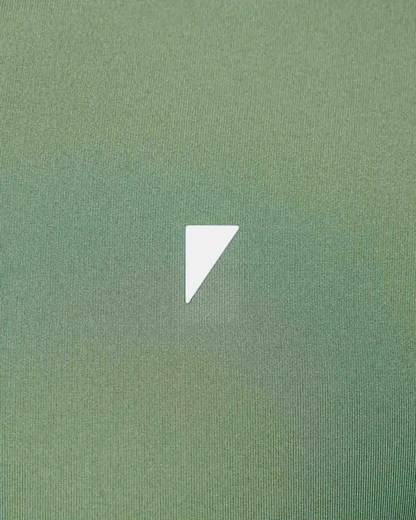 Close up detail of Primo brand iconmark - white triangle logo