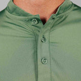 Close-up of a green polo shirt with buttons on a gray background