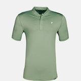 Green polo shirt on a light gray background