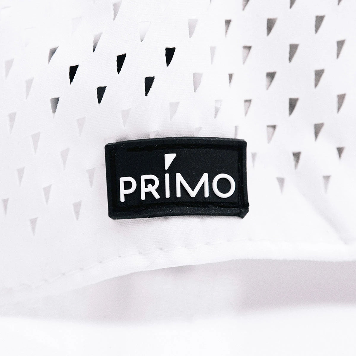 Close up detail of rubber Primo label sewn to hat