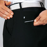 Person wearing black pants with a white belt and visible brand logo and back pocket zipper.