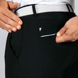 Person wearing black pants with a white belt and visible brand logo and back pocket zipper.
