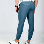 Person wearing blue pants on a white background