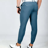 Person wearing blue pants on a white background