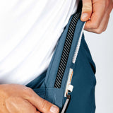 Person showing off the interior details on the blue pants. 