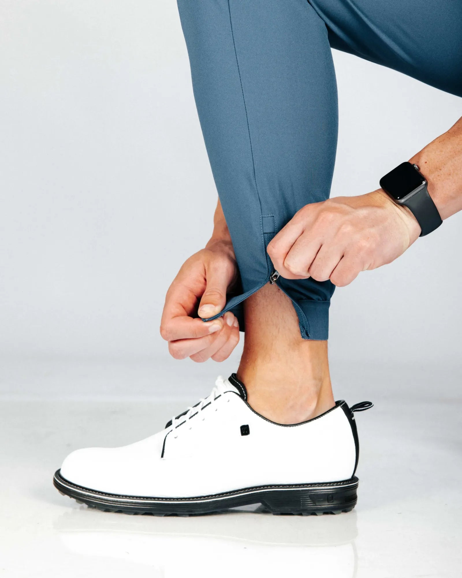 Person showing off the hem cuff zipper for easy access