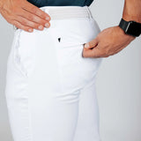 Model showing off back pocket zip on white pants. 