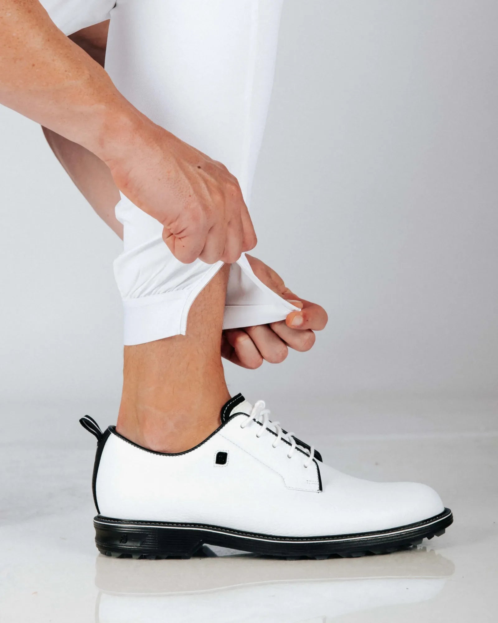 Male model showing there is a zip on the cuffed hem making them easy to wear.