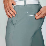Smoke green pants with a white belt and a back zip pocket