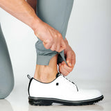 Person showing that there is a hem zip that gives options of how you want to wear them. Also makes them easy to get in and out of.  White shoes also featured in photo