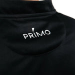 Black polo with 'Primo' logo on the back of it