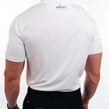 Person wearing a white polo shirt with 'PRIMO' logo on the back, standing against a plain background.