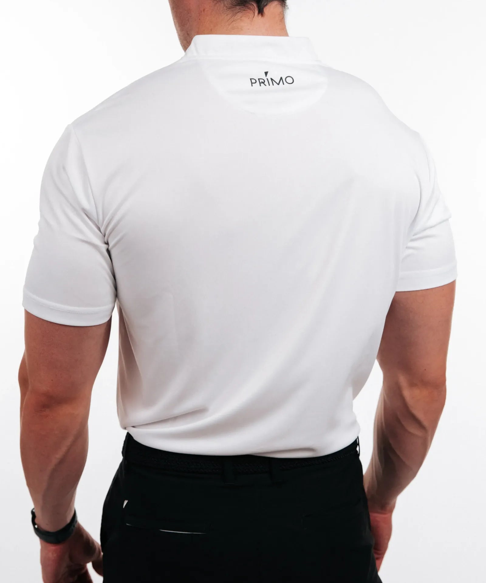 Person wearing a white polo shirt with 'PRIMO' logo on the back, standing against a plain background.
