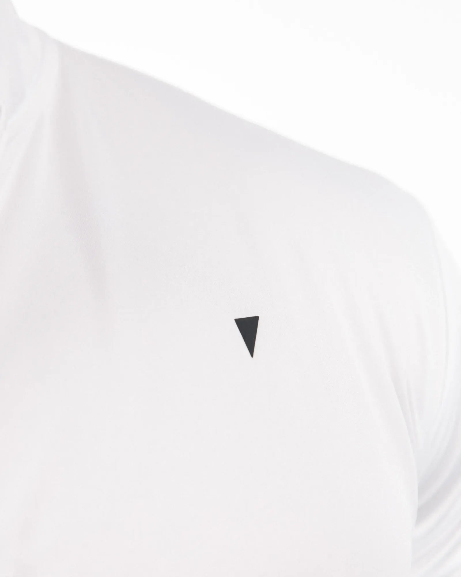 White golf polo with a black triangle logo on a white background