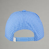 Blue cap with textured pattern on a gray background