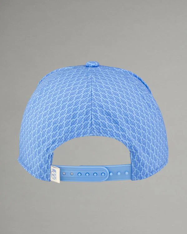 Blue cap with textured pattern on a gray background
