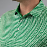 Close-up of a green patterned polo shirt with a gray background