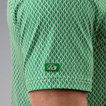 Green patterned shirt with a logo on a gray background