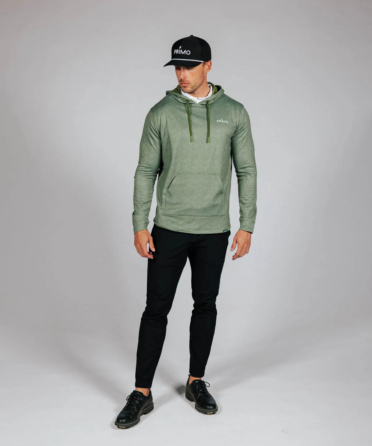 Man wearing green hoodie with Primo logo