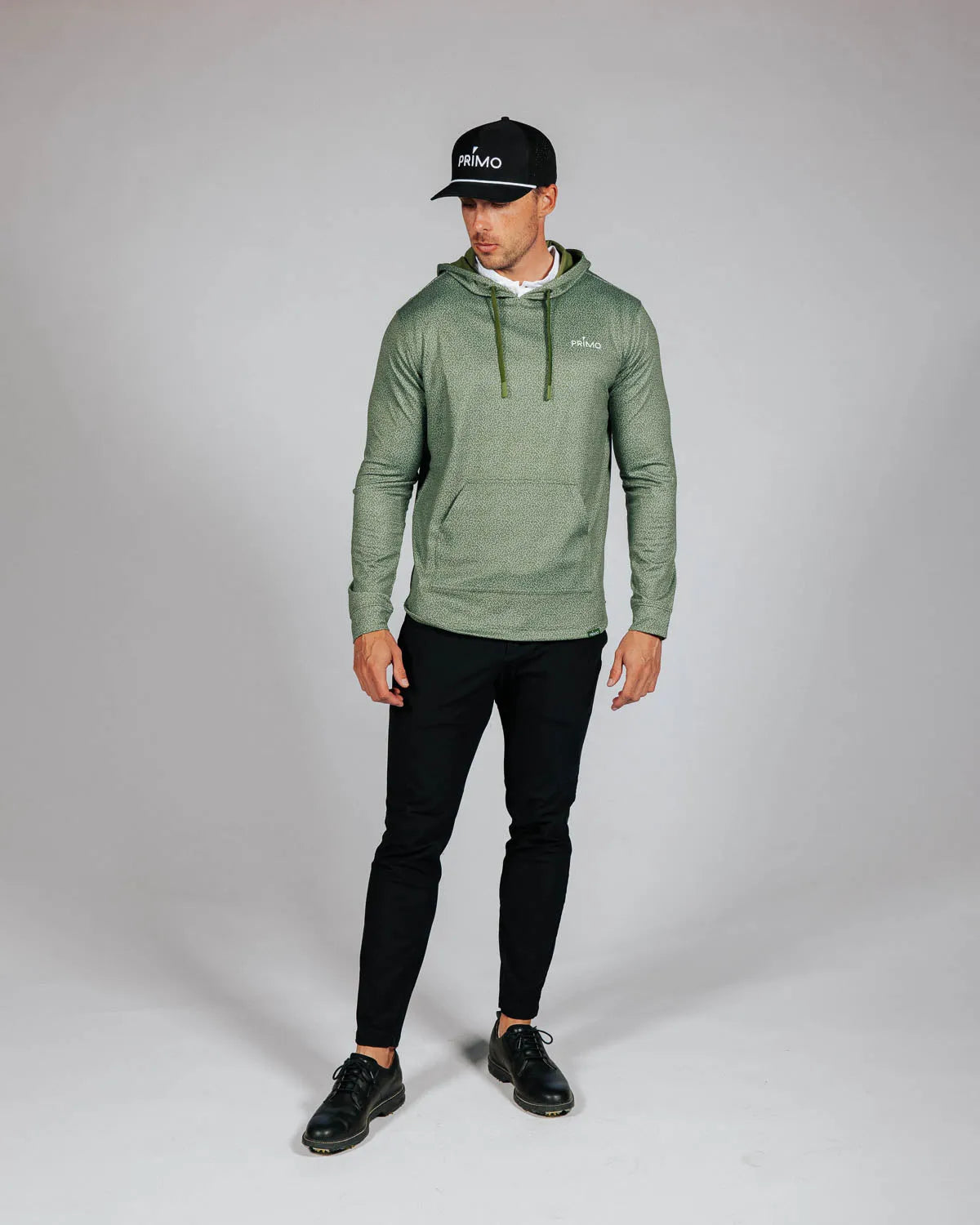 Man wearing green hoodie with Primo logo