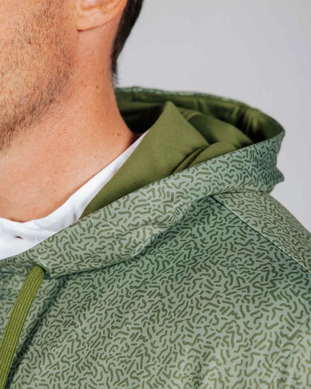 Close up detail of green hoodie