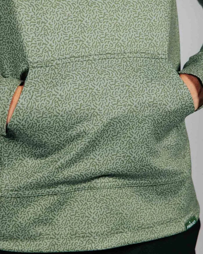Close up detail of green hoodie with geometric pattern