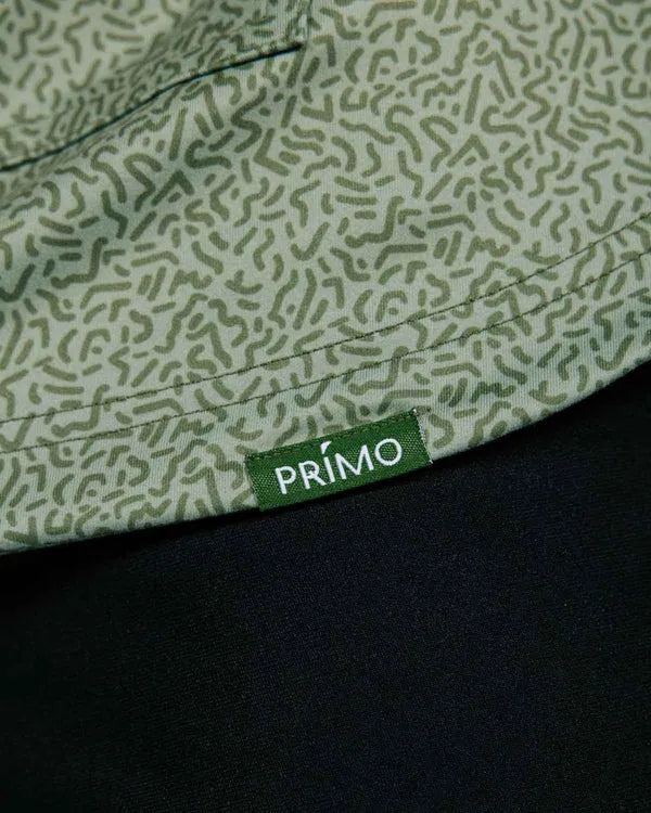 Close up green hoodie with geometric pattern. Embroidered Primo logo sewn on.