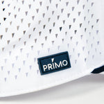 Close up of Primo rubber label sewn to outside of hat